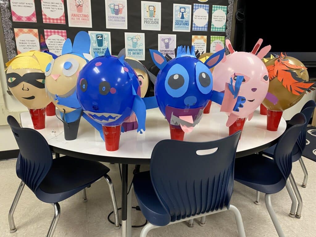 Table of student made parade balloons from a Balloons Over Broadway family balloon workshop